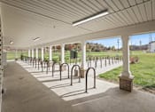 Thumbnail 47 of 84 - a row of metal bike racks under a covered walkway