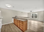 Thumbnail 7 of 51 - a kitchen with a counter top and a refrigerator