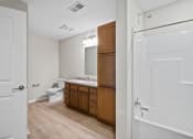 Thumbnail 19 of 19 - a bathroom with a toilet and a sink and a mirror