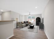 Thumbnail 2 of 19 - a living room with a couch and a table