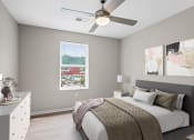 Thumbnail 1 of 19 - a bedroom with a bed and a ceiling fan