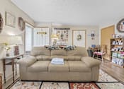 Thumbnail 10 of 27 - a living room with a couch and a rug