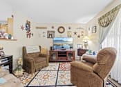 Thumbnail 9 of 27 - a living room filled with furniture and a tv