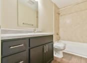Thumbnail 24 of 29 - a bathroom with a toilet sink and bathtub