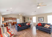 Thumbnail 21 of 27 - a living room with couches and chairs