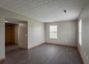 Thumbnail 49 of 83 - A room with a window and a door.