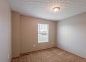 Thumbnail 54 of 83 - A room with a window and a ceiling light.