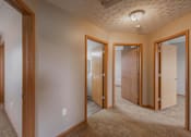 Thumbnail 61 of 83 - A room with a carpeted floor and a ceiling fan.
