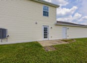 Thumbnail 63 of 83 - A house with a white door and a window.