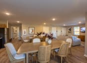 Thumbnail 6 of 55 - A dining room with a table and chairs.