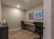 Thumbnail 8 of 55 - A room with two chairs and two framed pictures on the wall.