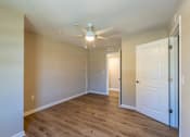 Thumbnail 43 of 55 - A room with a ceiling fan and two doors.