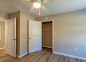 Thumbnail 44 of 55 - A room with a ceiling fan and three doors.