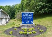 Thumbnail 1 of 72 - a sign in front of a house