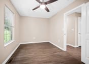 Thumbnail 6 of 72 - an empty room with a ceiling fan and a window