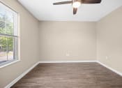 Thumbnail 10 of 72 - an empty bedroom with a ceiling fan and a window