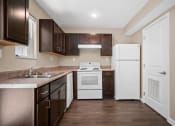 Thumbnail 12 of 72 - a kitchen with a stove refrigerator and sink