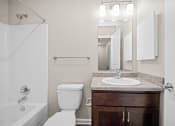 Thumbnail 30 of 72 - a bathroom with a toilet sink and shower and a mirror