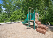 Thumbnail 21 of 72 - a playground with a slide and a picnic table
