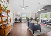 Thumbnail 27 of 72 - a living room with couches and chairs and large windows