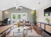 Thumbnail 35 of 72 - a living room with a couch and a table