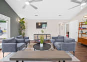 Thumbnail 26 of 72 - a living room with couches and a coffee table