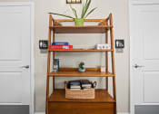 Thumbnail 32 of 72 - a shelf with a potted plant sitting on top of it