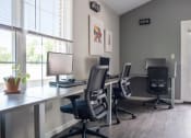 Thumbnail 40 of 72 - three desks with computers and chairs in an office