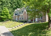 Thumbnail 46 of 72 - the front of a house with a lawn and a tree