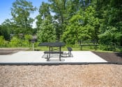 Thumbnail 72 of 72 - a picnic area with a table and chairs on a platform