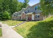 Thumbnail 58 of 72 - a house with a lawn and a sidewalk in front of it