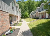 Thumbnail 59 of 72 - a sidewalk in front of a row of houses