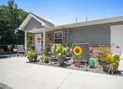 Thumbnail 62 of 72 - the front yard of a house with flowers and potted plants