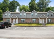 Thumbnail 53 of 72 - a parking lot in front of an apartment building