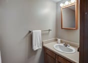 Thumbnail 24 of 24 - A white towel is hanging on a towel rack in a bathroom.