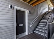 Thumbnail 52 of 76 - A black door with the number 203 on it.