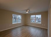 Thumbnail 2 of 37 - Empty room with a ceiling fan and two windows.