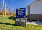 Thumbnail 65 of 76 - A sign for Kershaw Green stands in front of a building.