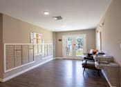 Thumbnail 26 of 52 - A room with a row of mailboxes on the wall.