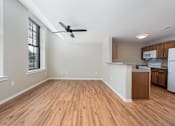 Thumbnail 53 of 58 - A room with wooden floors and a ceiling fan.