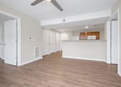 Thumbnail 9 of 64 - a spacious living room with a kitchen in the background