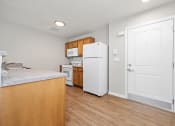 Thumbnail 20 of 64 - a kitchen with a white refrigerator freezer next to a stove top oven