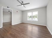 Thumbnail 13 of 64 - an empty room with a ceiling fan and a window