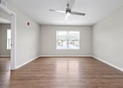 Thumbnail 17 of 64 - an empty room with a large window and a ceiling fan