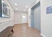 Thumbnail 53 of 64 - a corridor with a bench and a door