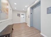 Thumbnail 64 of 64 - a long hallway with a bench and a door