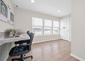 Thumbnail 60 of 64 - a home office with hardwood floors and a large window