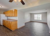 Thumbnail 43 of 59 - A kitchen with wooden cabinets and a refrigerator.