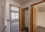 Thumbnail 59 of 59 - A room with a wooden door and a window.