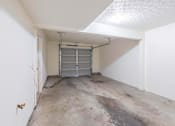 Thumbnail 54 of 59 - A white room with a metal gate in the middle.